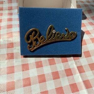 Avon Goldtone “Believe” pin NIB vintage 2007